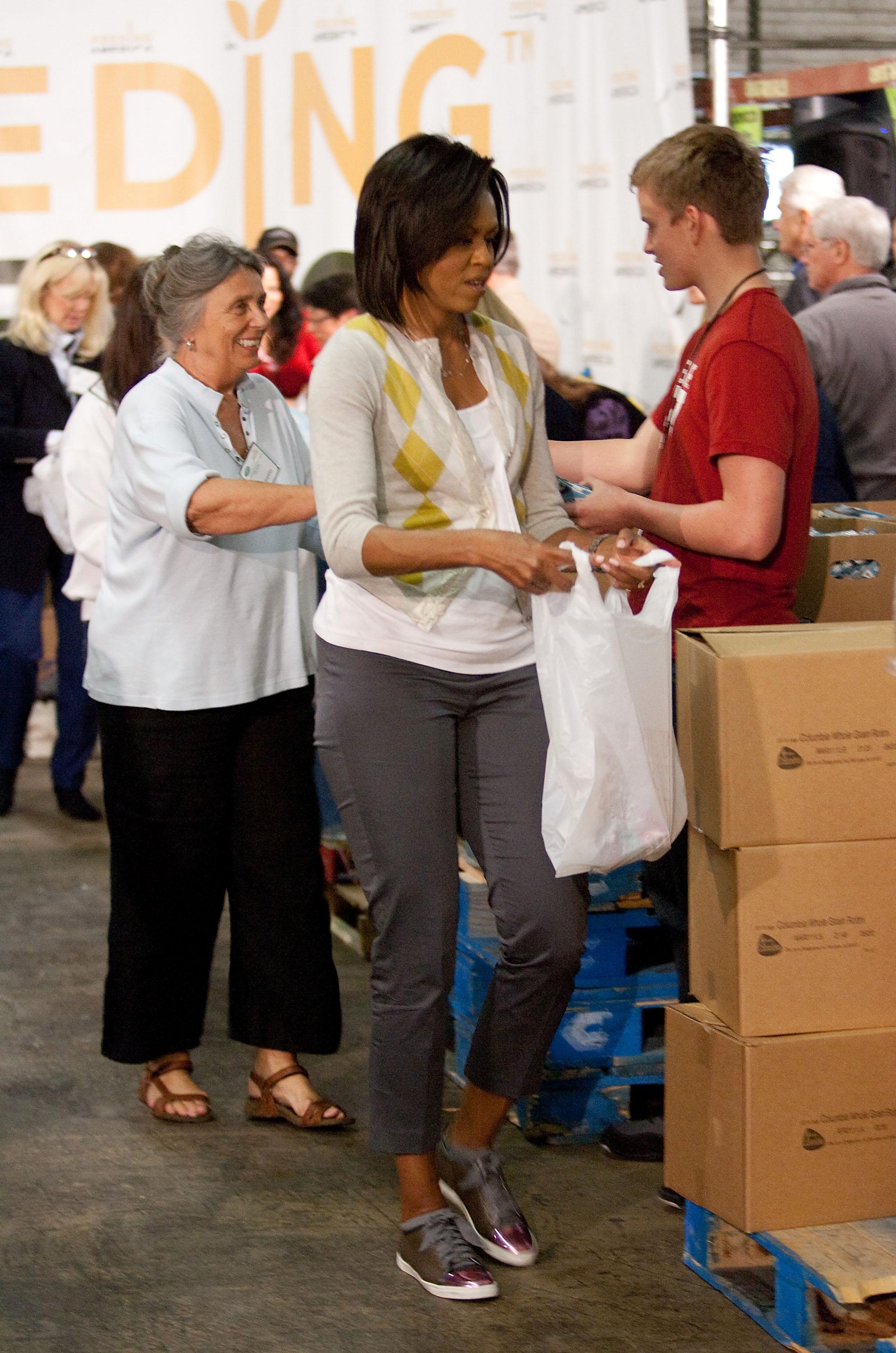 Michelle Obama and Dr. Jill Biden Volunteer for Feeding America