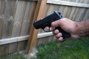 Man holding handgun pistol
