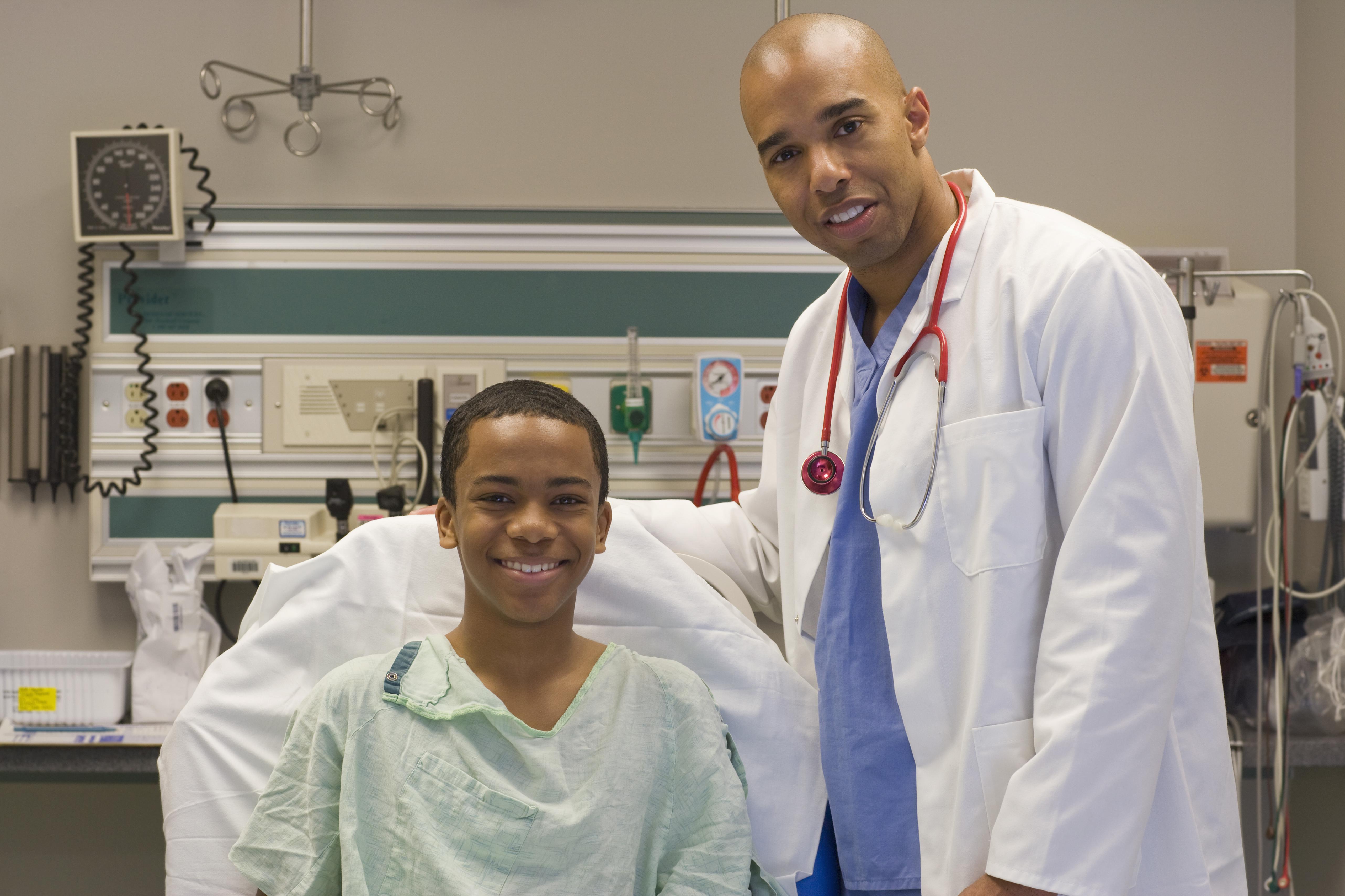 Doctor in hospital room with patient